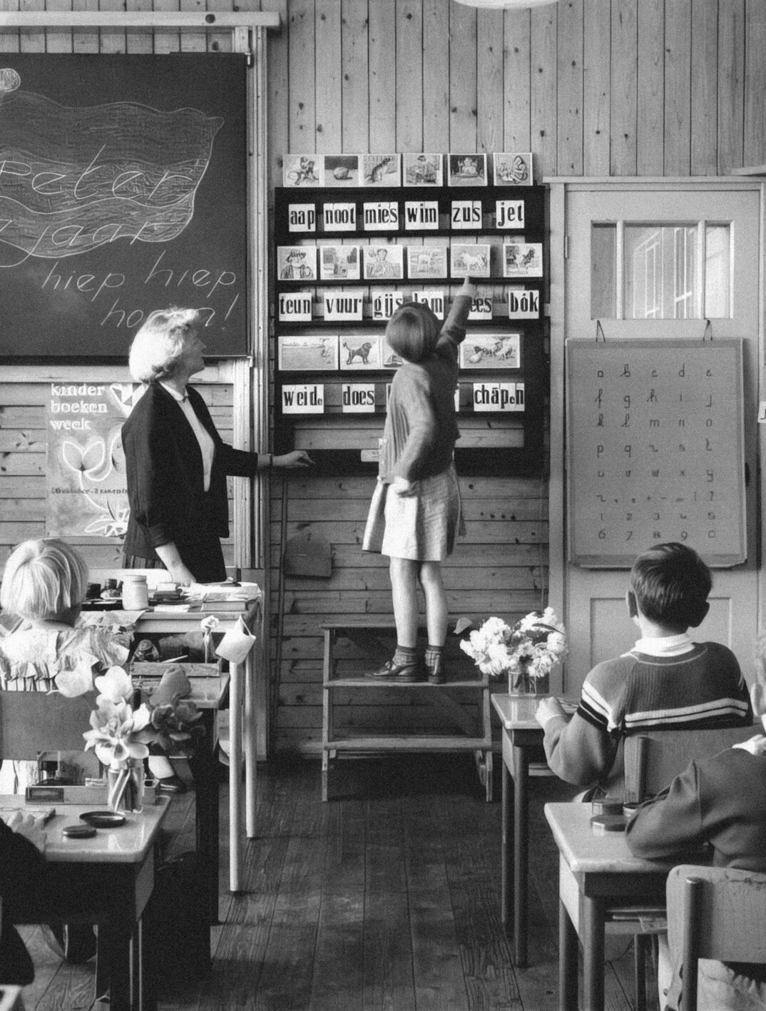Modern training room with desks and a projector screen