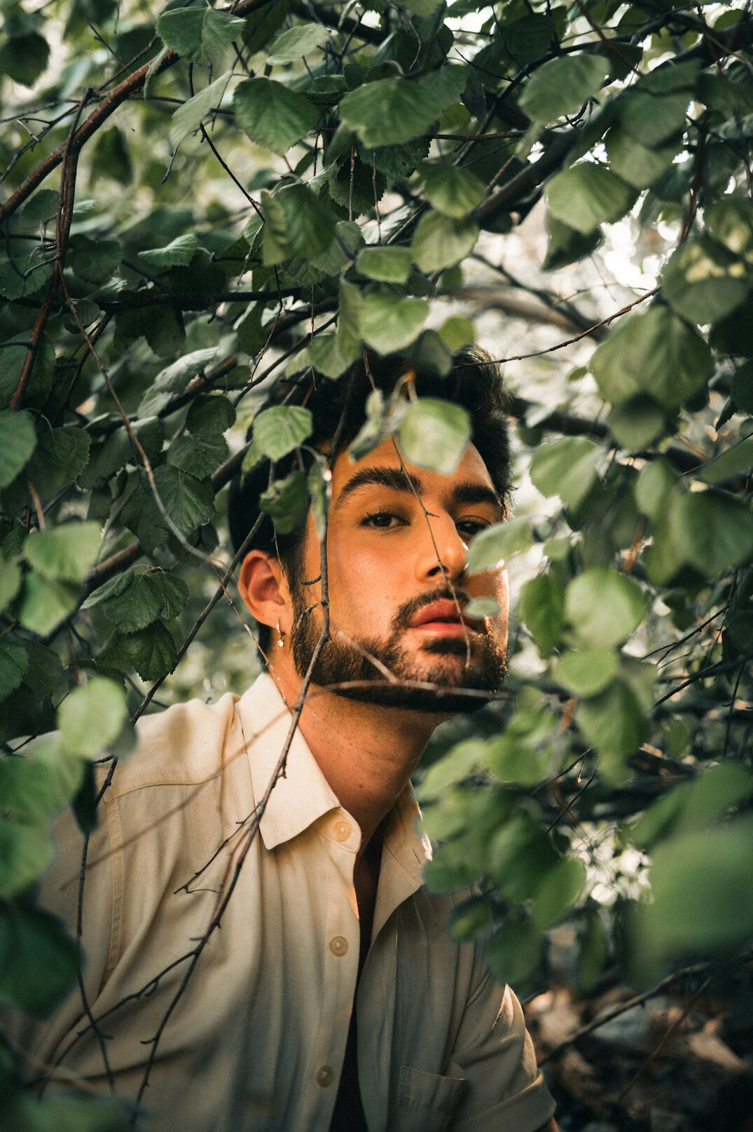 Portrait of a man with a short beard in a light shirt