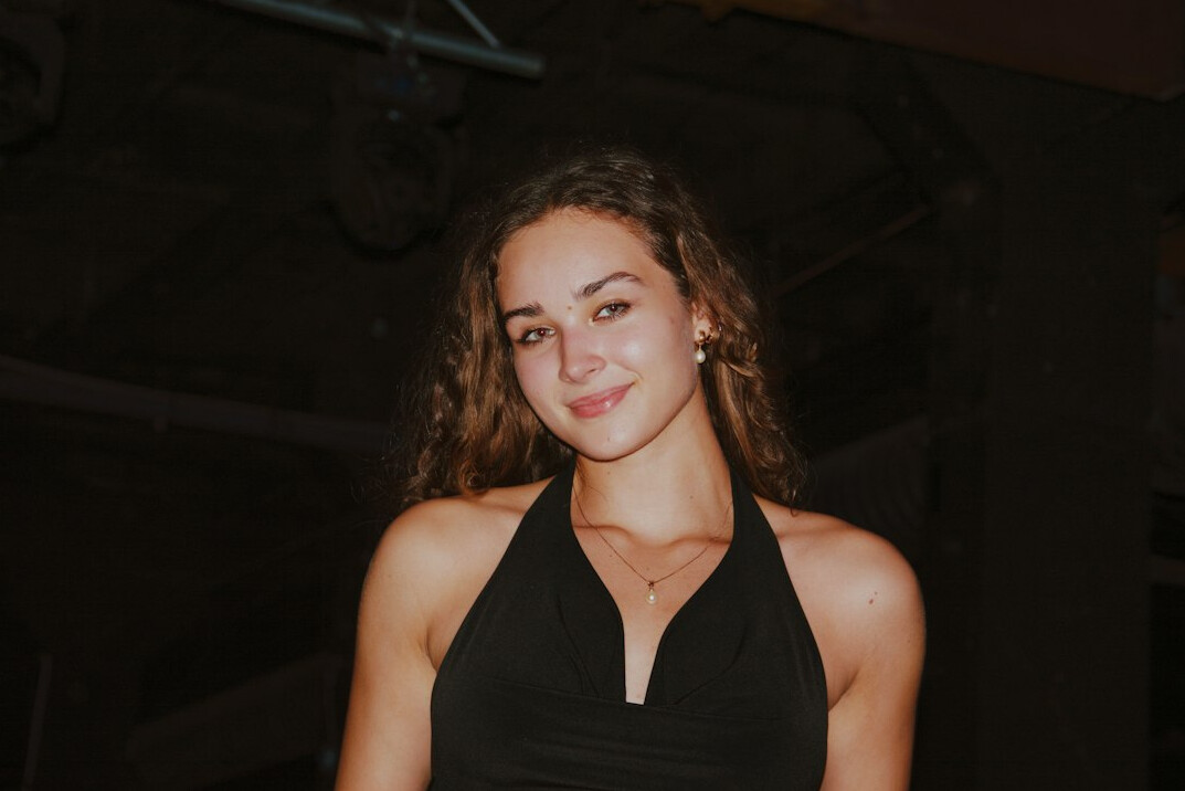 Portrait of a smiling woman with shoulder-length brown hair
