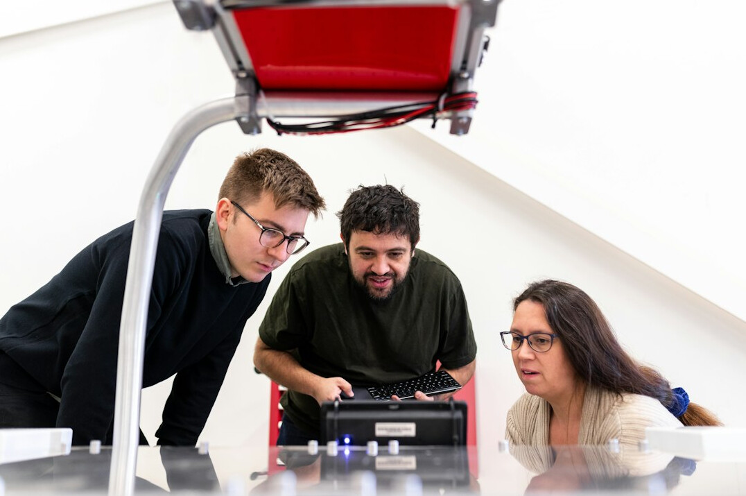 group of adults in coding workshop