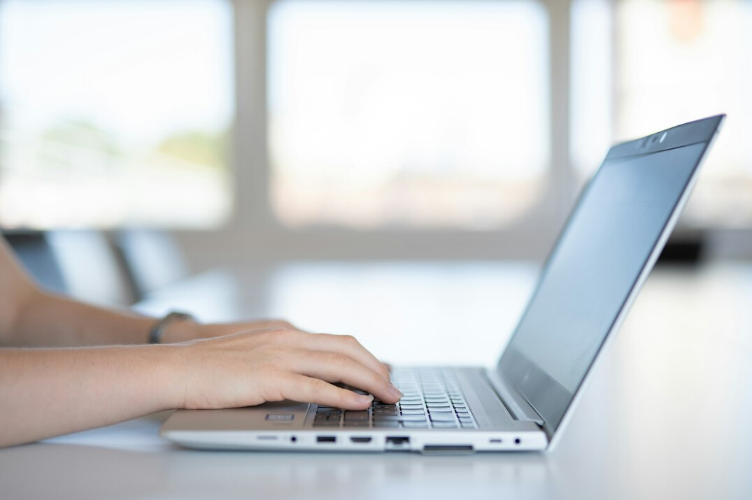 person studying at laptop